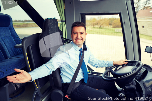 Image of happy driver inviting on board of intercity bus