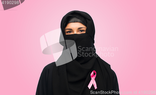 Image of muslim woman with breast cancer awareness ribbon