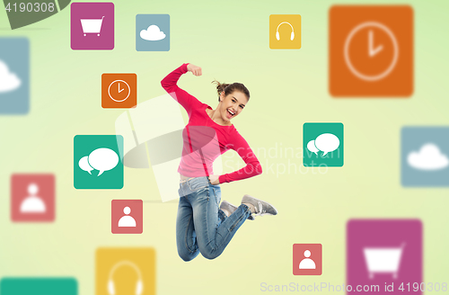 Image of smiling young woman jumping in air with menu icons