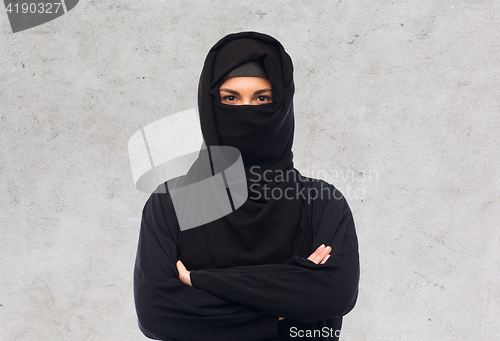 Image of muslim woman in hijab over gray background