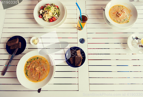 Image of close up of pasta with tomato and cheese on plate