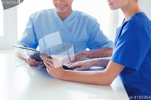 Image of close up of doctors with clipboard at hospital