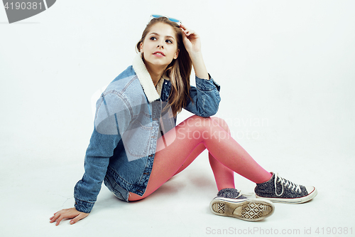Image of young pretty teenage hipster girl posing emotional happy smiling on white background, lifestyle people concept