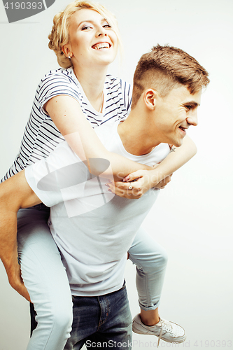 Image of young pretty teenage couple, hipster guy with his girlfriend happy smiling and hugging isolated on white background, lifestyle people concept