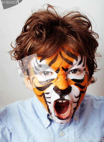 Image of little cute boy with faceart on birthday party close up, little 