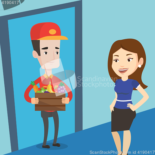 Image of Delivery man delivering groceries to customer.