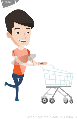 Image of Male customer running into the shop with trolley.