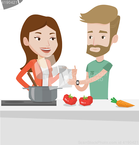 Image of Couple cooking healthy vegetable meal.