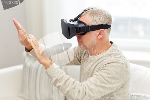 Image of old man in virtual reality headset or 3d glasses