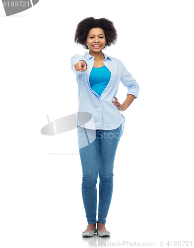 Image of happy african woman pointing finger to you