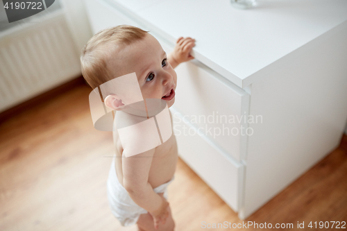 Image of close up of happy little baby boy or girl at home