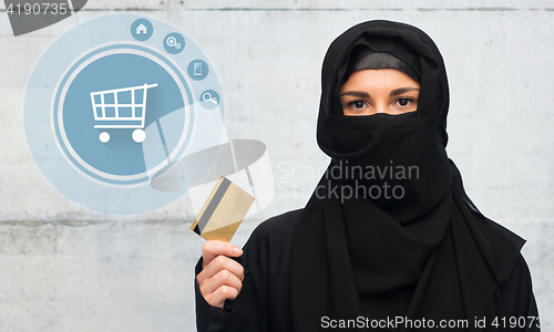 Image of muslim woman in hijab with credit card over white