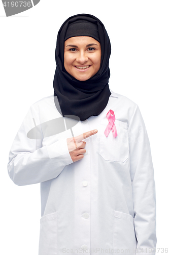 Image of muslim doctor with breast cancer awareness ribbon