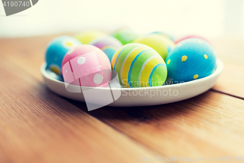 Image of close up of colored easter eggs on plate