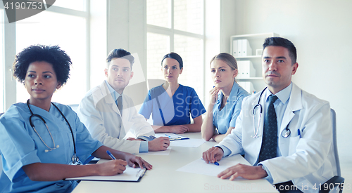 Image of group of happy doctors meeting at hospital office