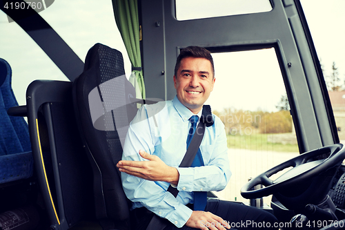 Image of happy driver inviting on board of intercity bus