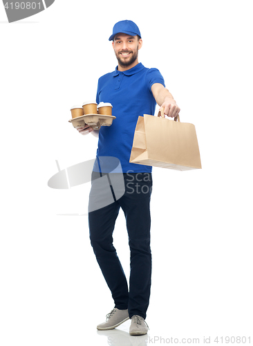 Image of happy delivery man with coffee and food in bag