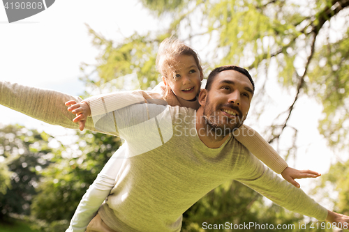 Image of happy family having fun in summer park