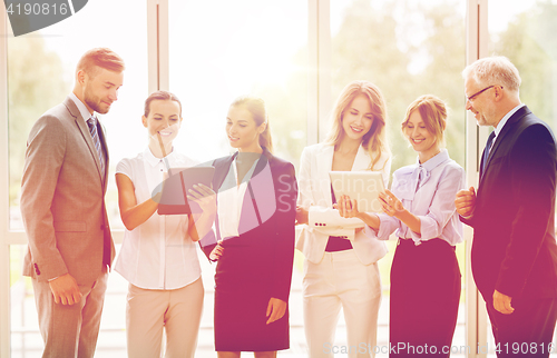 Image of business people with tablet pc computers at office