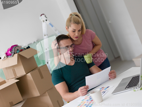 Image of Young couple moving in a new home