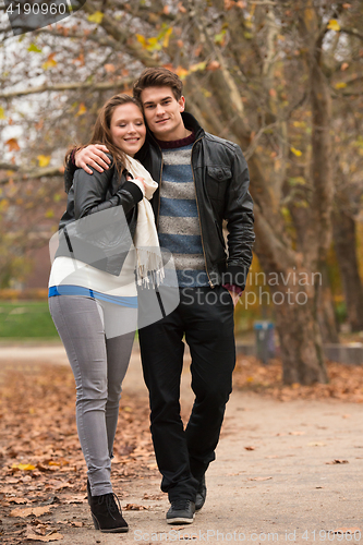 Image of Happy young Couple in Autumn Park