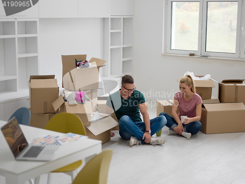 Image of young couple in new house