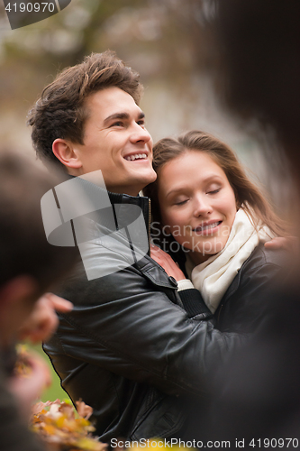 Image of Autumn portrait of attractive happy couple