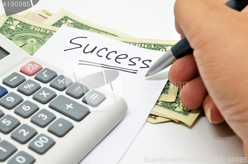 Image of Hand written success word on paper