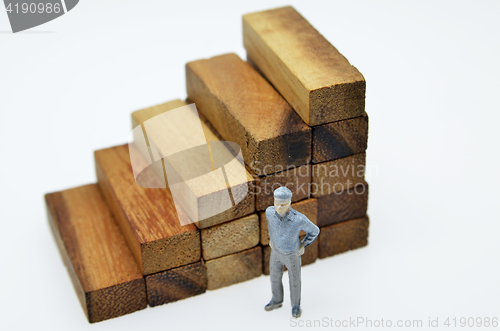 Image of Way to success with  businessman and wood block step