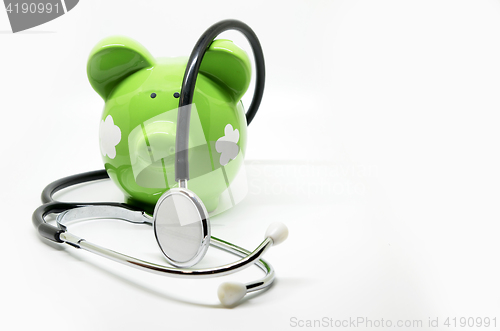 Image of Piggy bank and stethoscope
