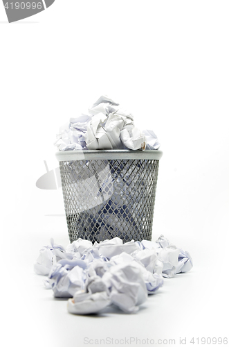 Image of Garbage bin with paper waste