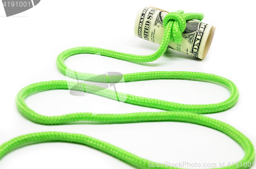 Image of Roll of hundred dollar bills related rope in knot 