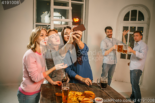 Image of Group of friends girls making selfie photo