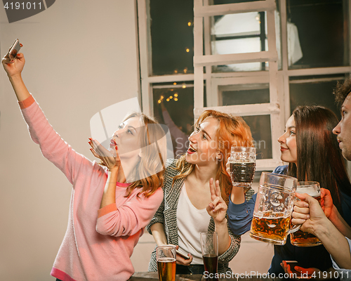 Image of Group of friends girls making selfie photo