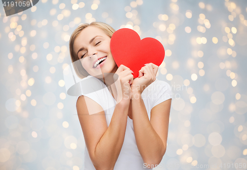 Image of happy woman or teen girl with red heart shape