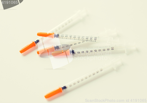 Image of close up of insulin syringes on table