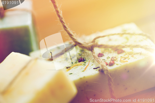 Image of close up of handmade soap bars on wood