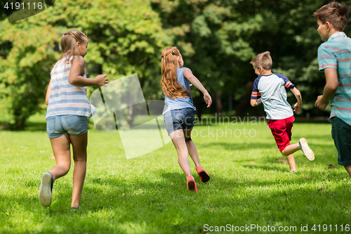 Image of group of happy kids or friends playing outdoors