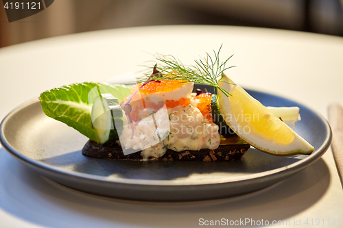 Image of close up of toast skagen with caviar and bread