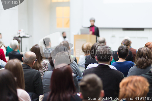 Image of Woman giving presentation on business conference.