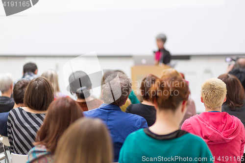 Image of Woman giving presentation on business conference.