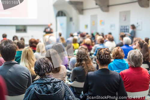 Image of Man giving presentation in lecture hall at university.