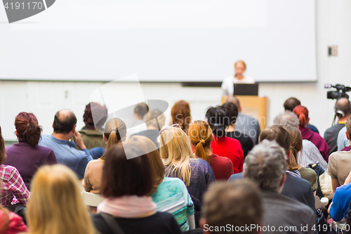 Image of Woman giving presentation on business conference.