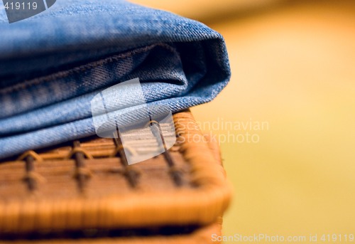 Image of jeans atop of a basket
