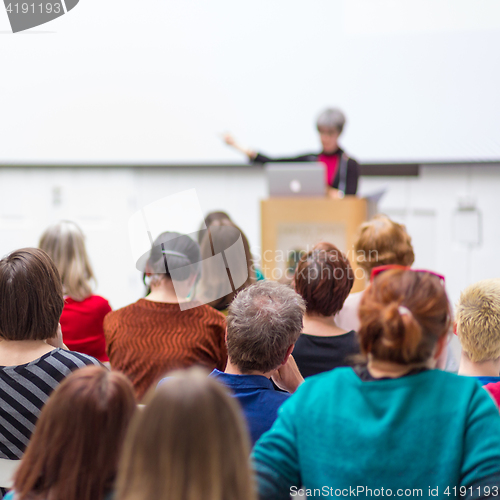 Image of Woman giving presentation on business conference.