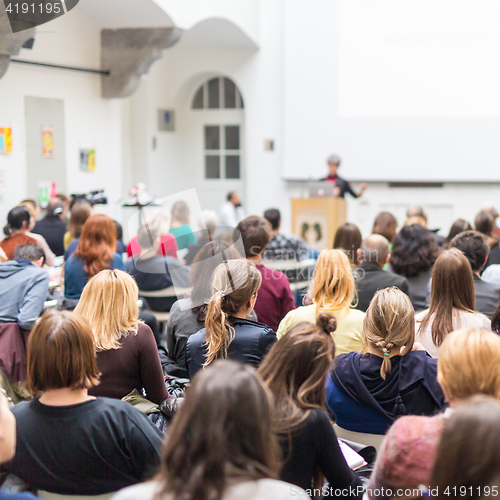 Image of Woman giving presentation on business conference.