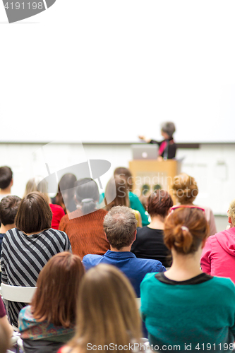 Image of Woman giving presentation on business conference.