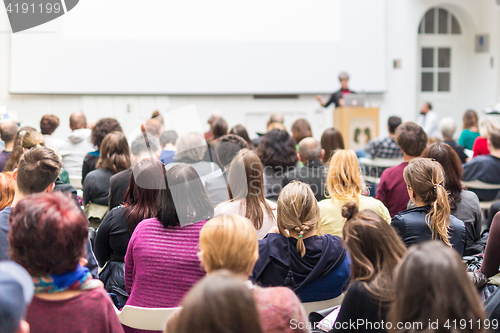 Image of Woman giving presentation on business conference.