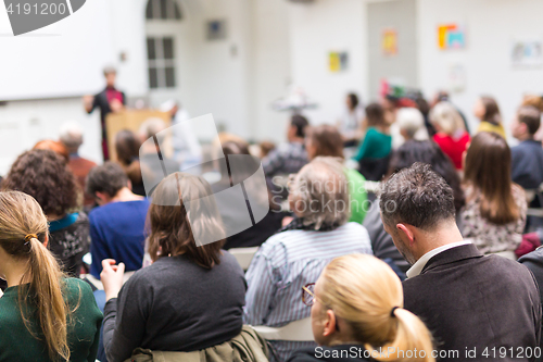 Image of Woman giving presentation on business conference.