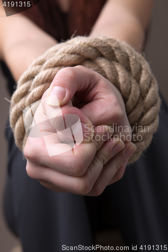 Image of Blindfolded hands woman with rope